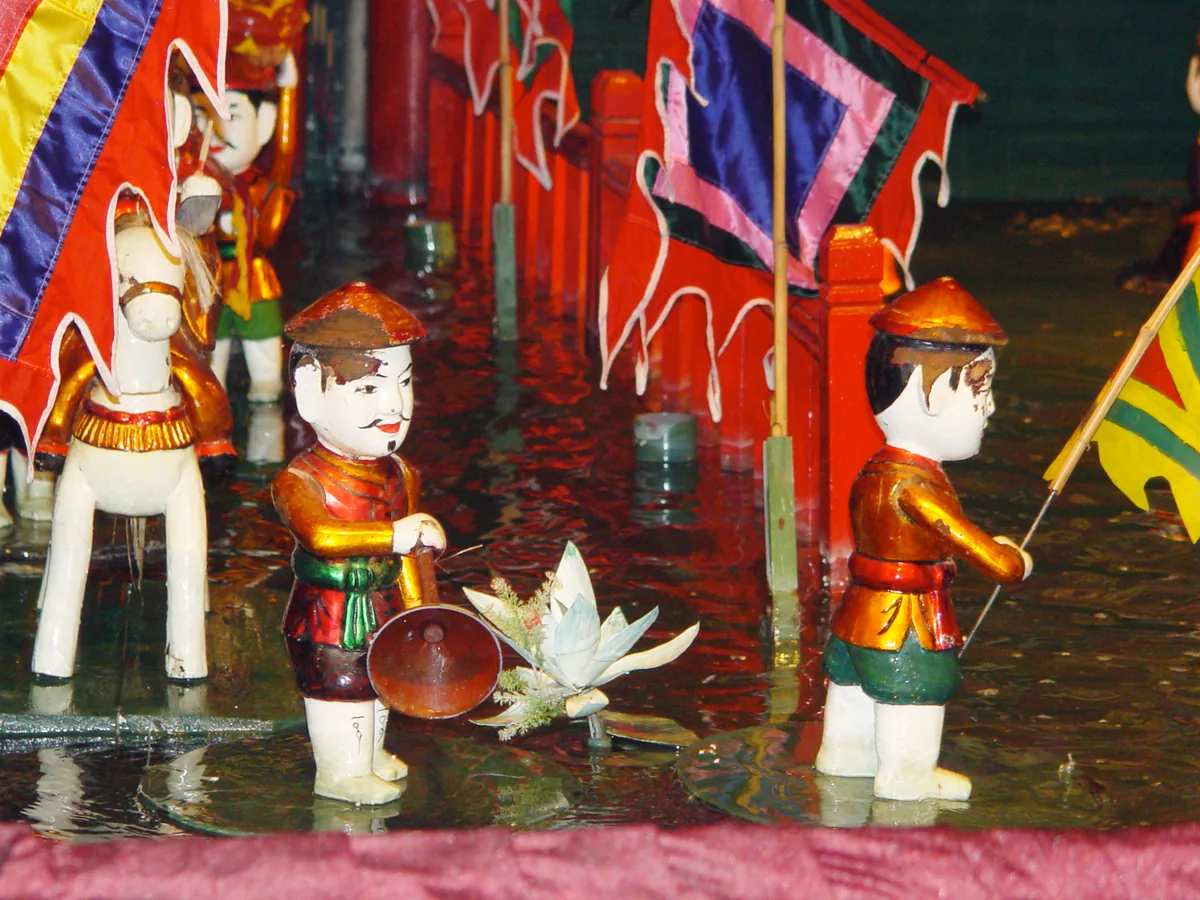 Water puppets performing on the illuminated pool